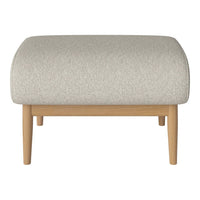 Light gray upholstered ottoman with a textured pattern and natural wood legs, creating a modern, minimalist aesthetic.