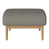 Gray upholstered ottoman with a subtle texture, paired with natural wood legs for a modern look.