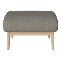 Gray upholstered ottoman with a textured pattern and light wooden legs, adding modern elegance to any space.