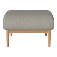 Light gray upholstered ottoman with a subtle textured pattern and natural wooden legs. Perfect for modern decor.