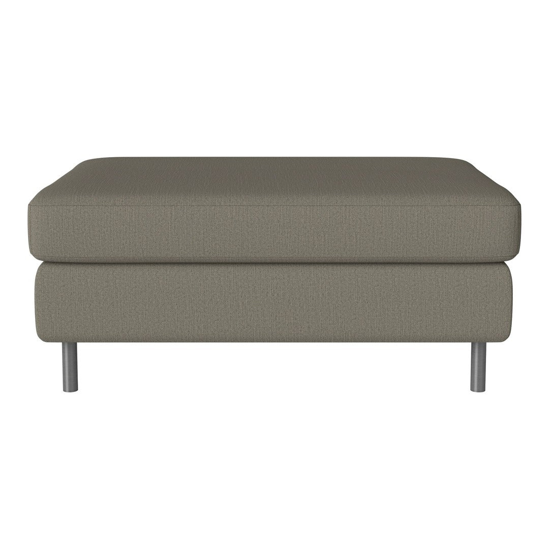 Gray upholstered ottoman with a smooth texture and modern metallic legs, perfect for contemporary decor.
