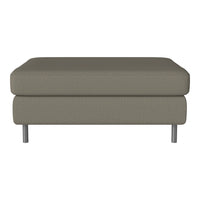 Gray upholstered ottoman with a smooth texture and modern metallic legs, perfect for contemporary decor.