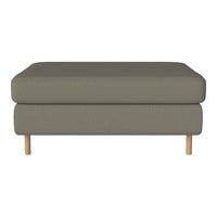 Gray upholstered ottoman with a smooth texture and wooden legs, perfect for modern living spaces.