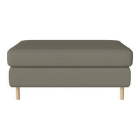Gray upholstered ottoman with a textured pattern and light wooden legs. Elegant and modern design for versatile decor.