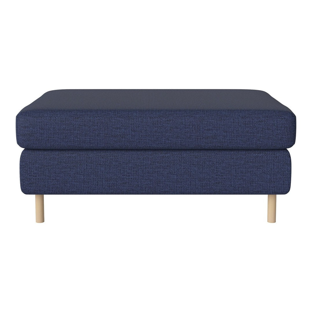 Navy blue fabric ottoman with a textured pattern and light wood legs. Stylish and modern home decor piece.