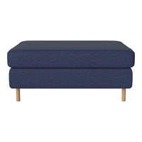 Navy blue ottoman with textured fabric and natural wood legs, perfect for modern interiors.
