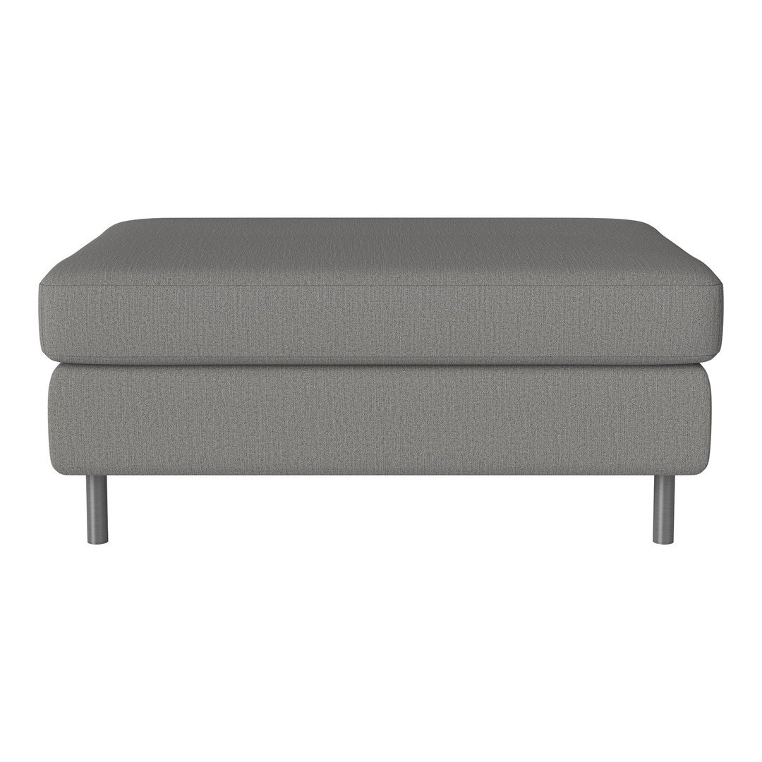 Gray upholstered ottoman with a smooth, textured surface and sleek metal legs, perfect for modern decor.