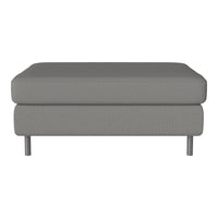 Gray upholstered ottoman with a smooth, textured surface and sleek metal legs, perfect for modern decor.