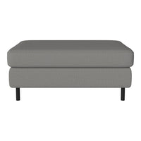 Gray upholstered ottoman with textured pattern and black legs. Elegant, modern design complements various decor styles.