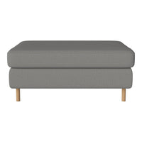 Gray upholstered ottoman with a textured pattern and natural wood legs. Modern and versatile design for any room.