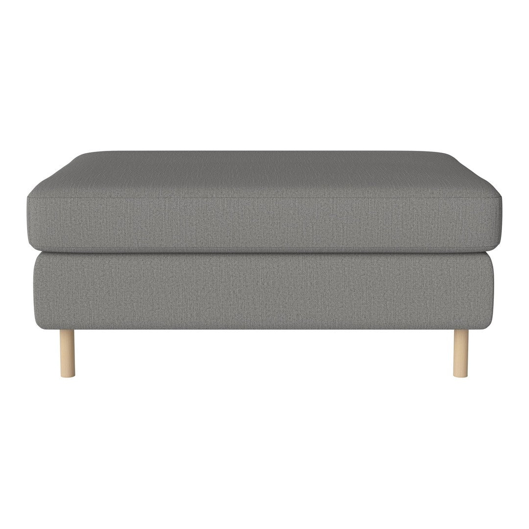 Gray upholstered ottoman with a smooth texture and natural wood legs, perfect for modern decor.