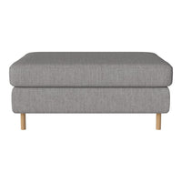 Gray upholstered ottoman with a smooth texture and light wood legs, perfect for modern decor.