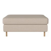 Beige fabric ottoman with a smooth surface and natural wood legs, ideal for modern living spaces.