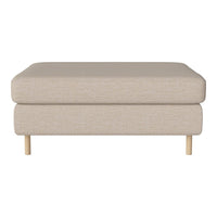 Beige ottoman with a smooth, textured fabric and natural wood legs. Simple, minimalist design perfect for any decor.