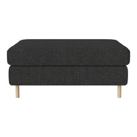 Black textured ottoman with minimalist design and light wooden legs, perfect for modern living spaces.