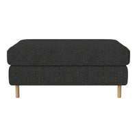 Dark charcoal upholstered ottoman with a sleek, minimalist design and light wooden legs.