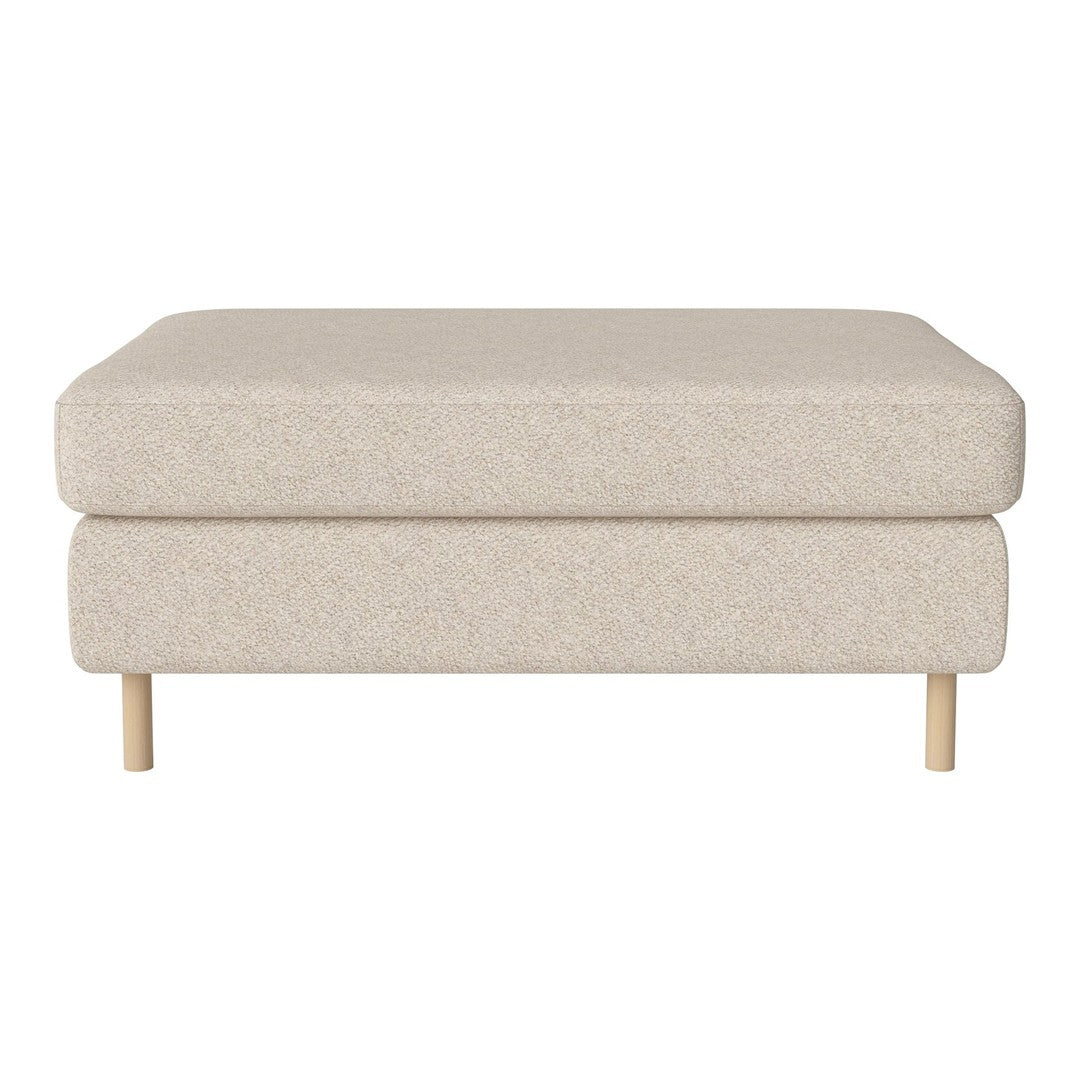 Neutral beige ottoman with a soft textured fabric and light wooden legs, perfect for modern decor.