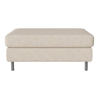 Beige textured ottoman with a modern design and sleek silver legs, perfect for any contemporary living space.