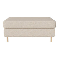 Beige upholstered ottoman with a soft texture and simple design, complemented by natural wood legs.
