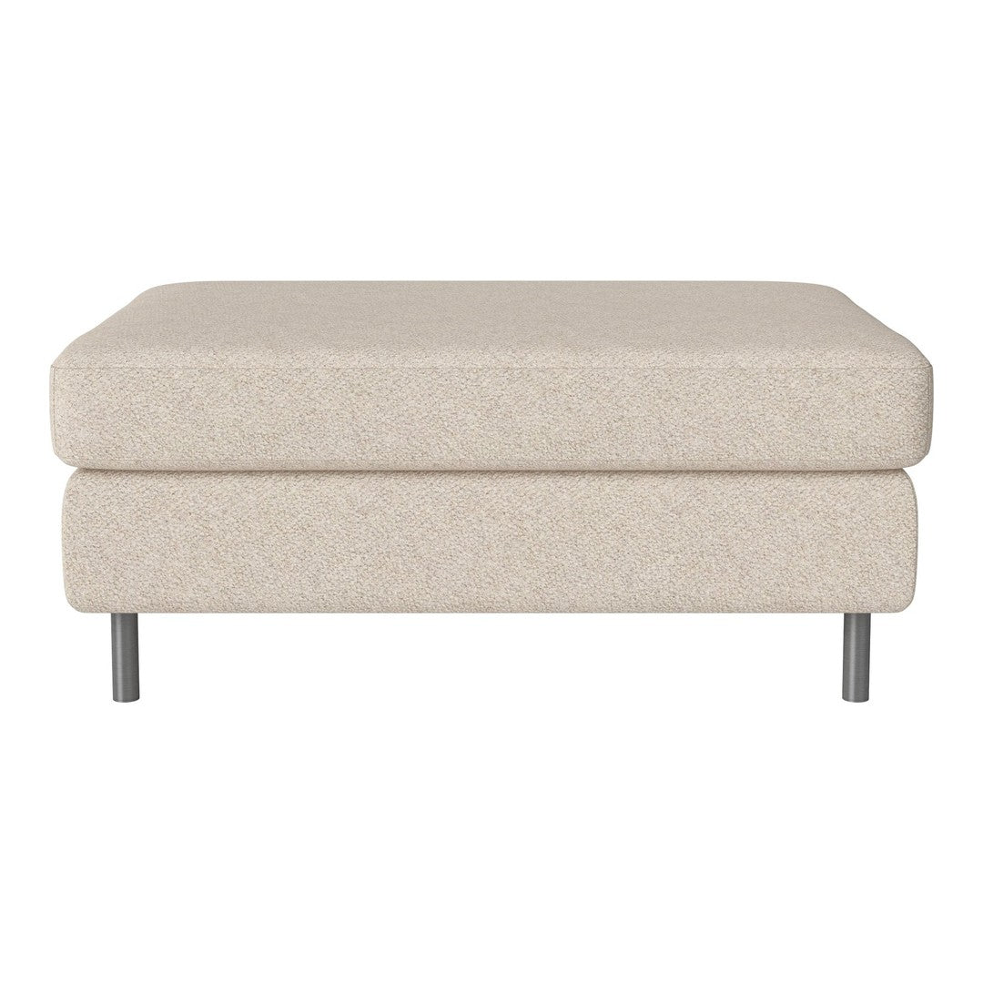 Beige textured ottoman with a soft finish, featuring a minimalist design and sleek metal legs.