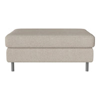 Light beige ottoman with a textured fabric finish and sleek silver legs, perfect for modern decor.