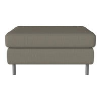 Neutral taupe ottoman with a textured fabric and sleek silver legs, offering a modern minimalist style.