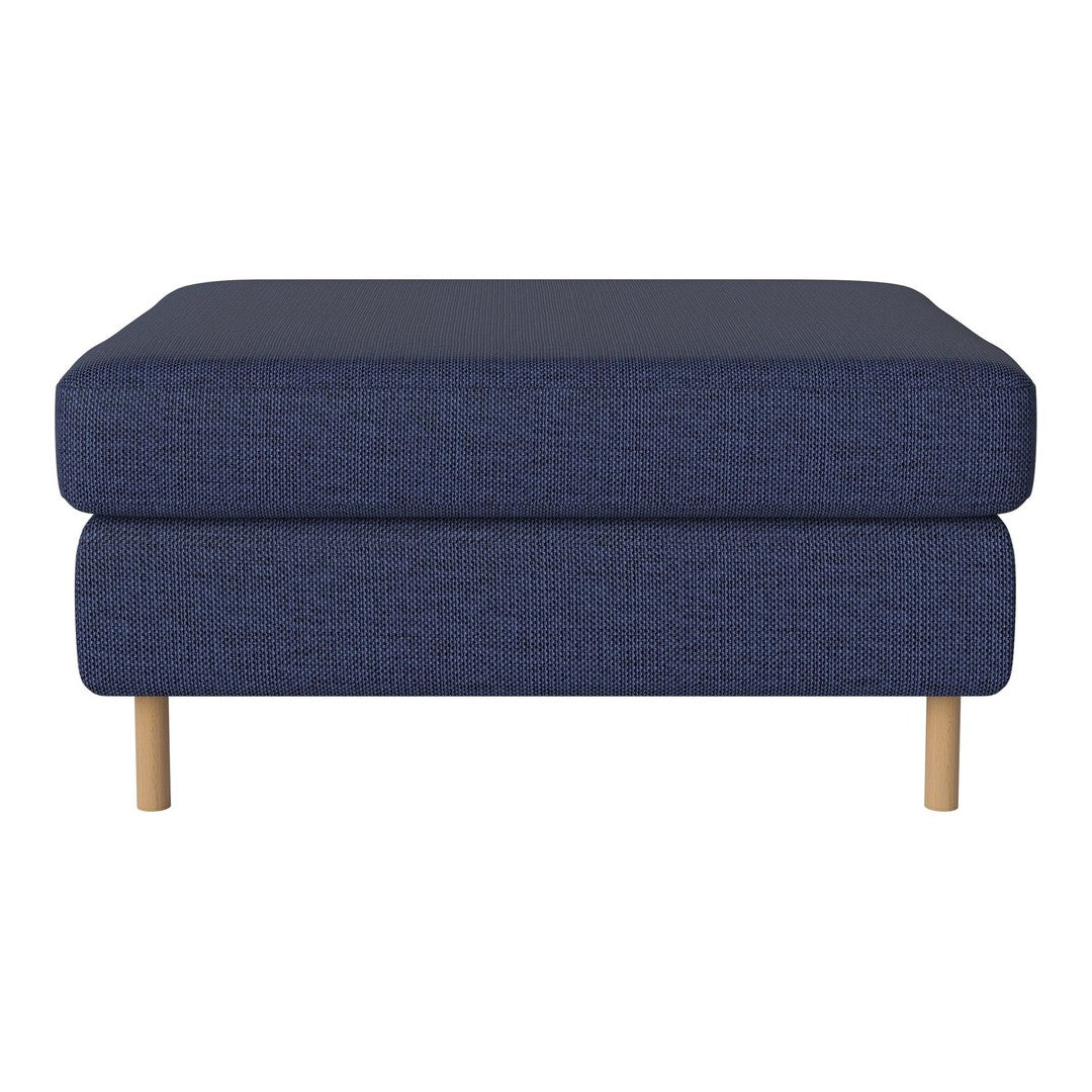 Navy blue upholstered ottoman with a textured pattern and light wood legs. Stylish, modern addition to any living space.