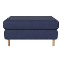 Navy blue upholstered ottoman with a textured pattern and light wood legs. Stylish, modern addition to any living space.