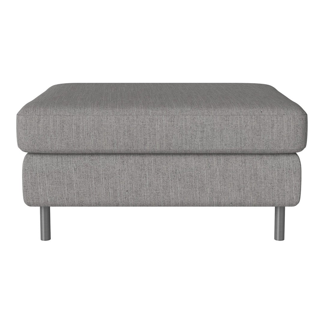 Gray fabric ottoman with a smooth texture and minimalist design, featuring subtle patterns, elevated on silver legs.