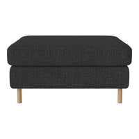 Black textured ottoman with two layers and light wood legs, featuring a minimalist design for modern interiors.