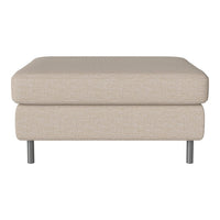 Beige upholstered ottoman with a smooth texture and sleek metal legs, perfect for modern decor.