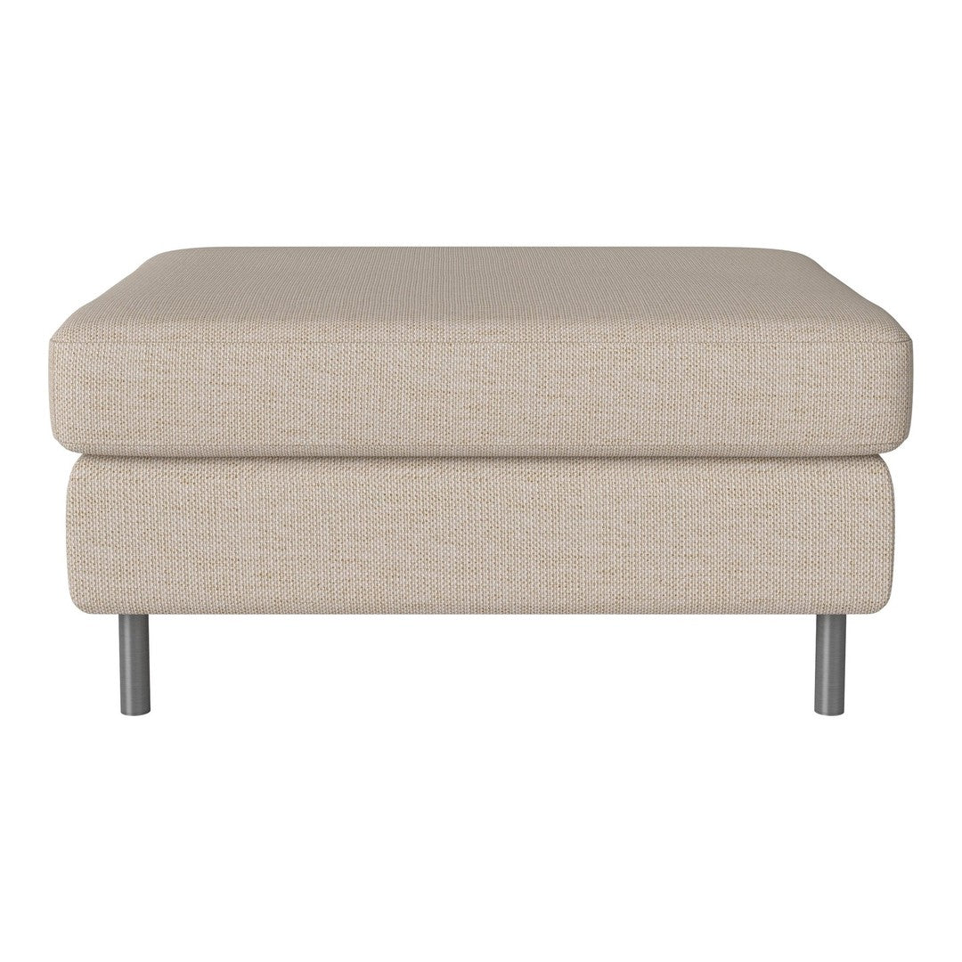 Beige upholstered ottoman with a smooth texture and silver metal legs, perfect for modern decor.