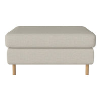 Light beige ottoman with a smooth fabric surface and natural wood legs, perfect for modern decor.
