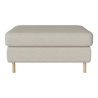 Light beige ottoman with a textured fabric and natural wood legs, perfect for modern living spaces.