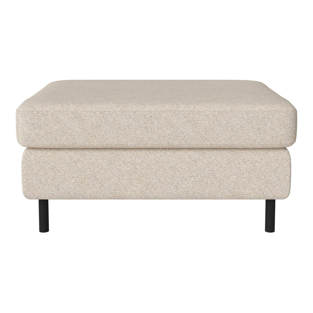 Light beige upholstered ottoman with a smooth texture, resting on sleek black legs. Minimalist and modern design.