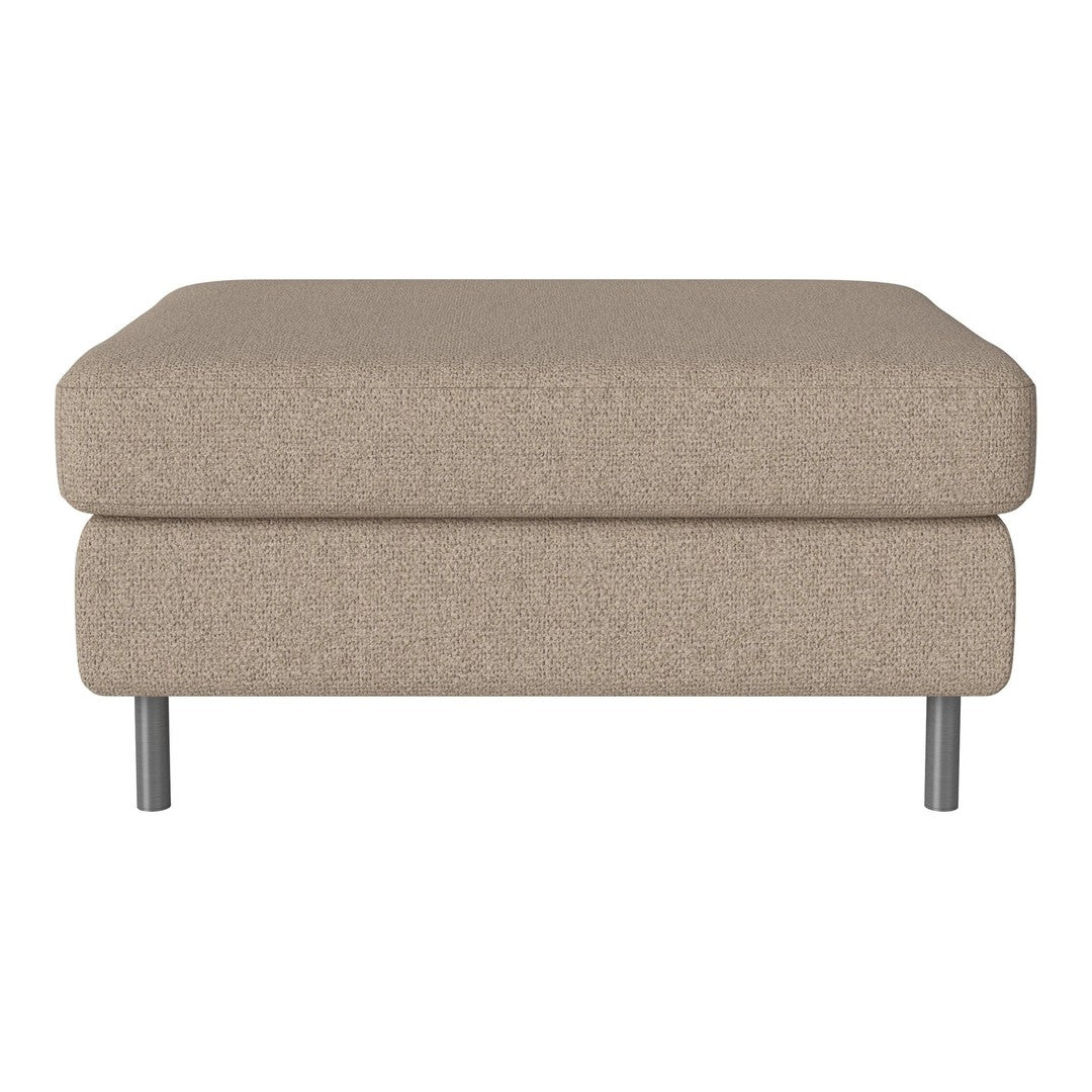Beige textured ottoman with a smooth top and sleek metal legs, perfect for any modern living space.