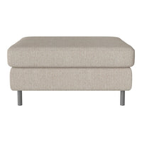 Beige upholstered ottoman with a smooth texture and minimalist design, featuring silver metal legs.