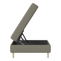 Gray upholstered storage ottoman with a minimalist design and light wooden legs.