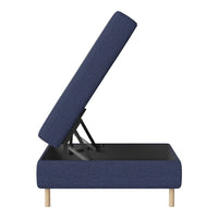 Navy blue upholstered ottoman with a textured fabric and a minimalistic design, featuring light wooden legs.