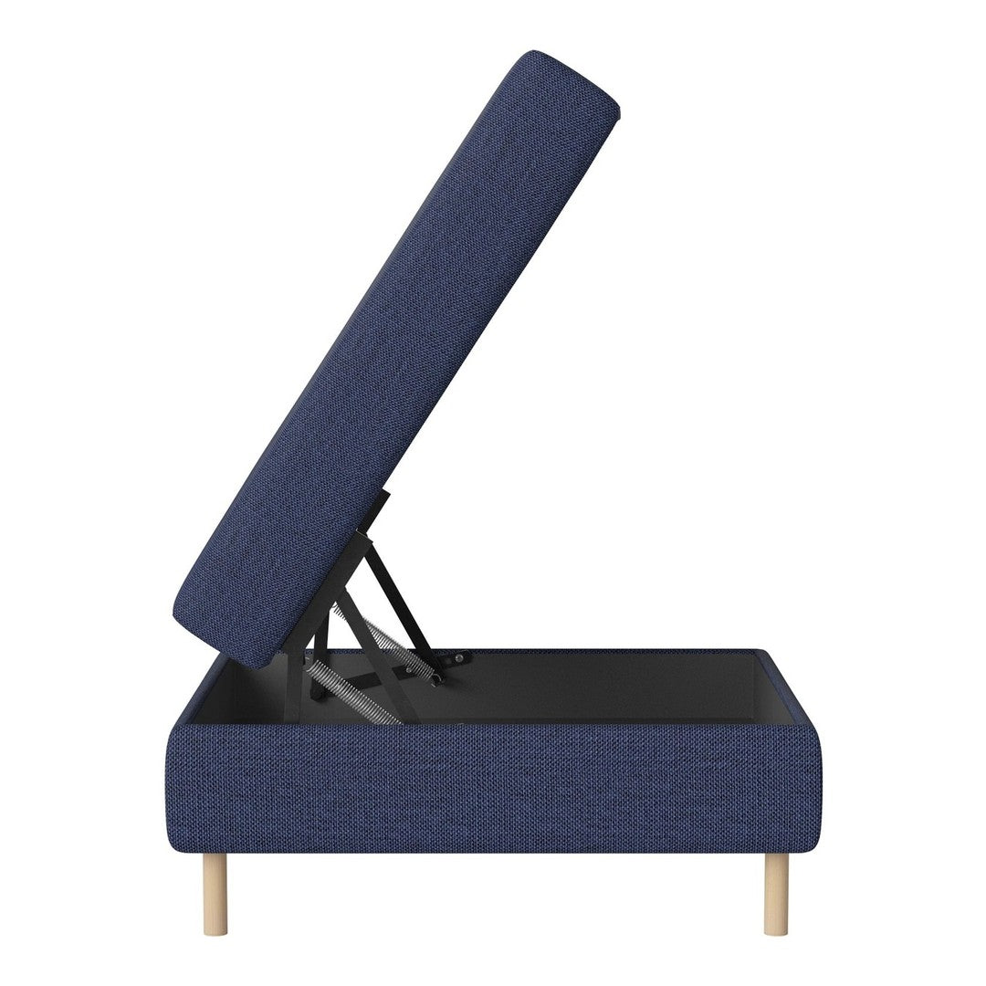 Navy blue upholstered ottoman with a textured pattern and wooden legs, showcasing an open storage compartment.