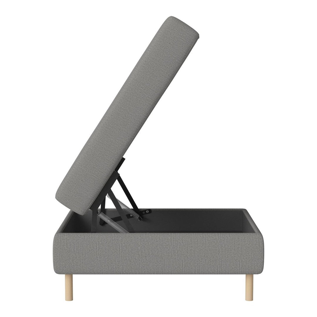 Gray upholstered storage bed with a simple, modern design and light wooden legs.