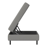 Gray upholstered storage bed with a textured pattern and sleek black legs, showcasing a modern design.