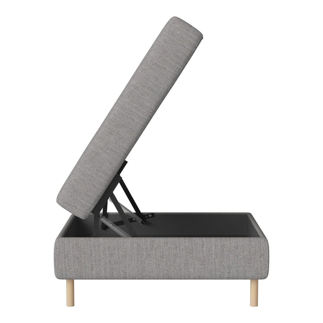 Gray upholstered storage ottoman with a minimalist design and light wood legs. Simple, modern aesthetic.