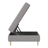 Gray upholstered storage ottoman with a minimalist design and light wood legs. Simple, modern aesthetic.