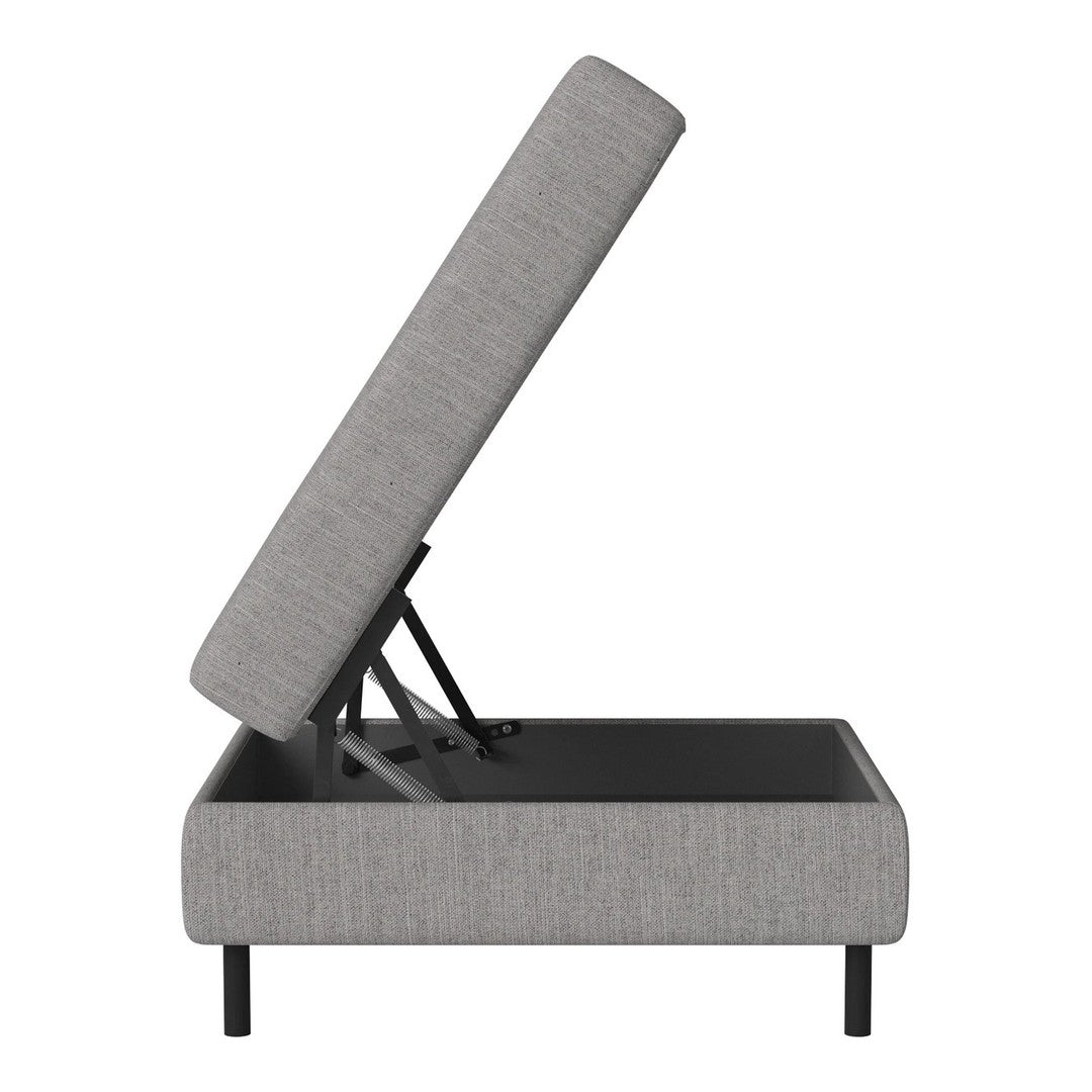 Gray upholstered storage ottoman with a minimalist design and sleek black base.