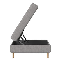 Gray upholstered storage ottoman with minimalist design and natural wooden legs. Functional lift-top lid.