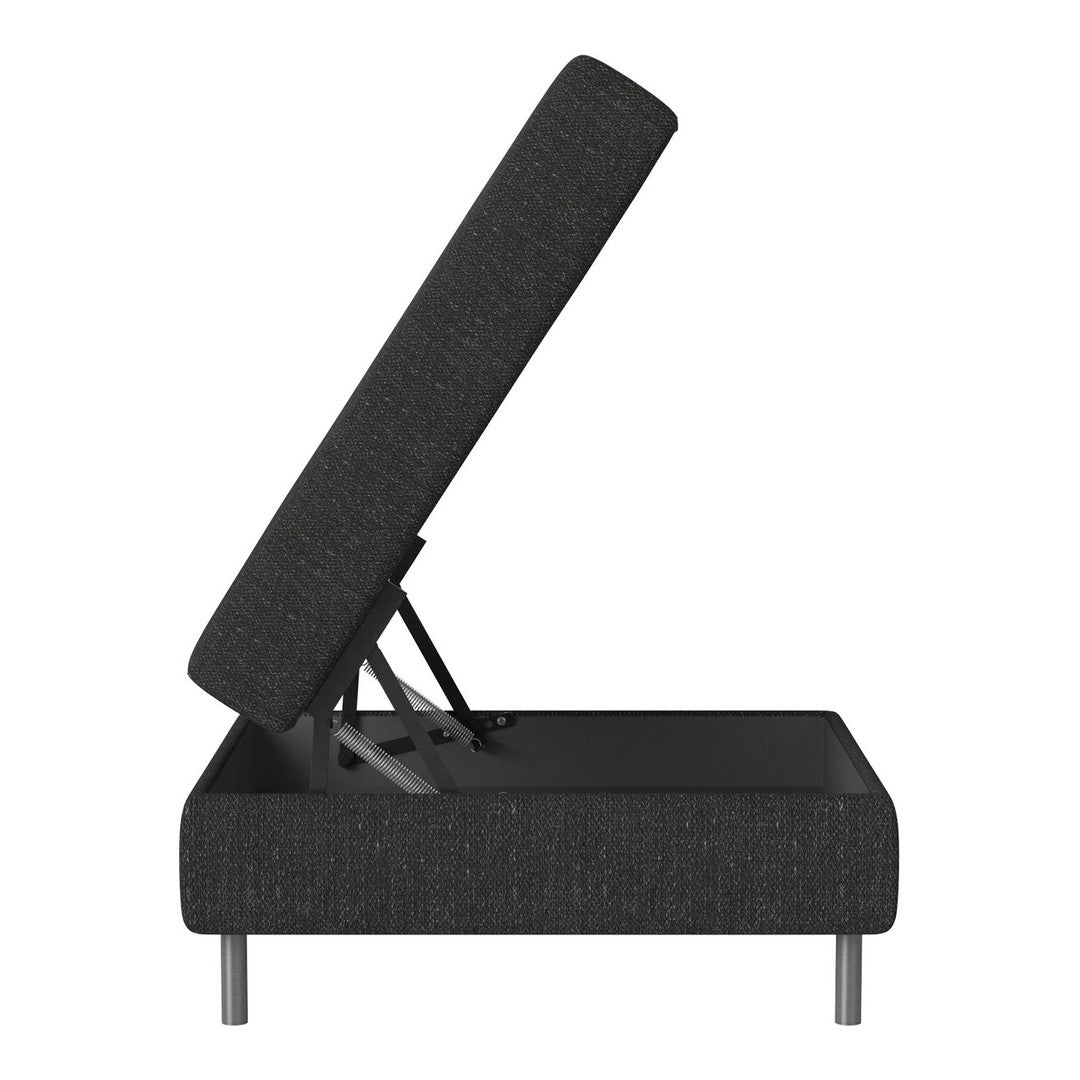 Black upholstered storage ottoman with a textured pattern and sleek metal legs, showcasing a modern design.