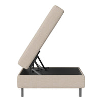 Beige upholstered ottoman with a minimalist design, featuring a hidden storage compartment and sleek metal legs.