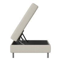 Light beige upholstered storage ottoman with a minimalist design and black interior. Perfect for modern decor.
