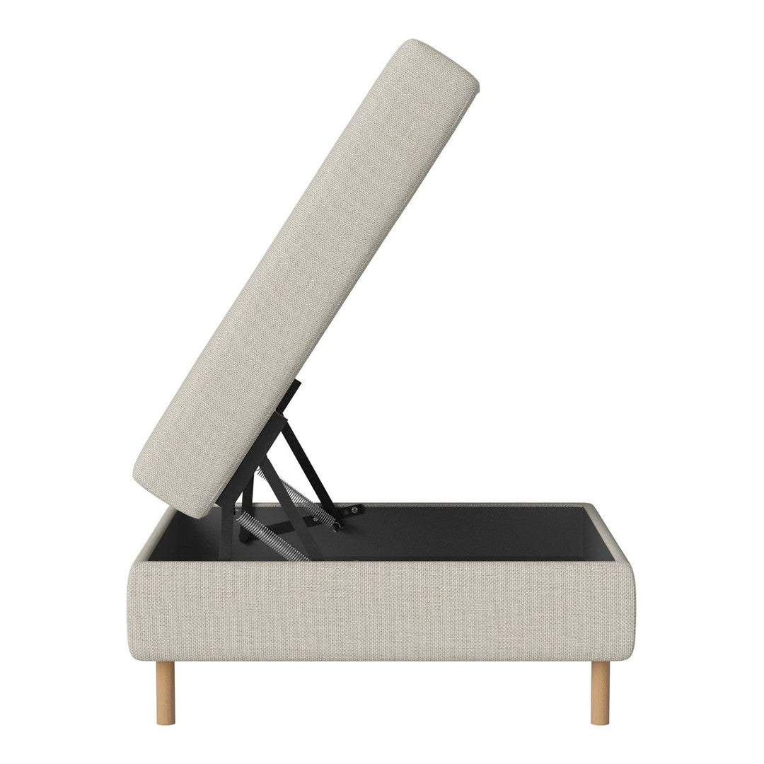 Light beige upholstered storage ottoman with wooden legs, showcasing a minimalist design and sleek lines.